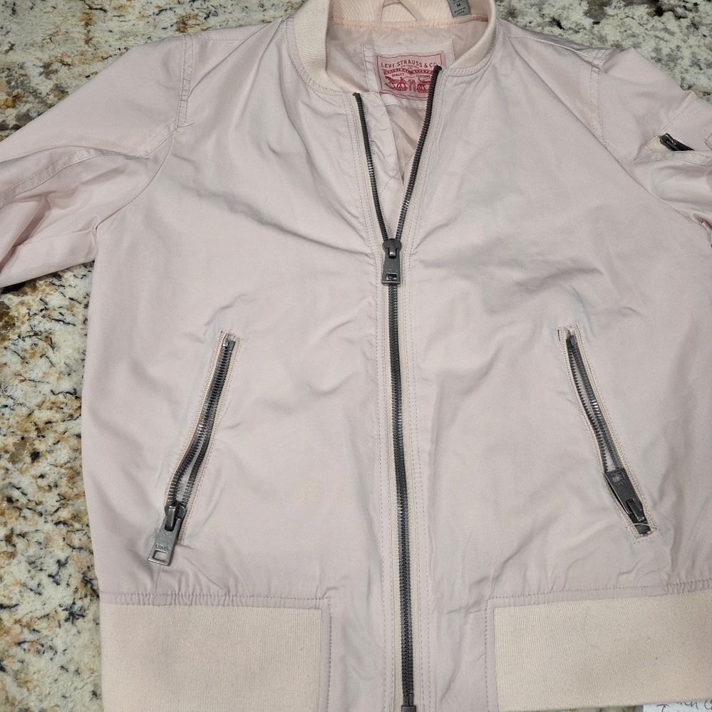 light pink levi bomber jacket.